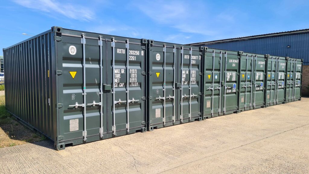 20ft shipping containers lined up in a raw.