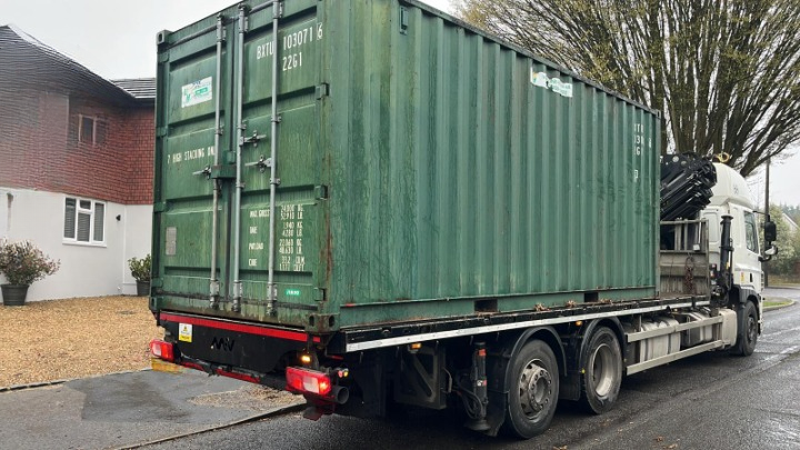 A shipping container on a hiab